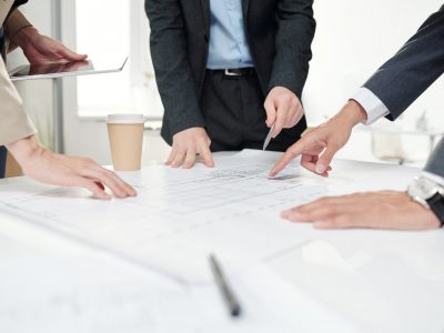 Business People Discussing Construction Plans